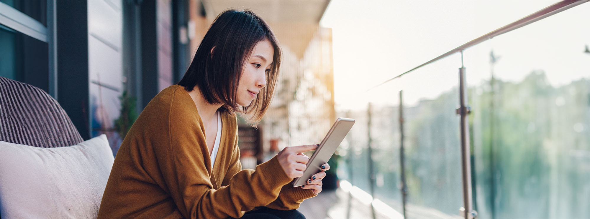 woman reviewing information on a tablet